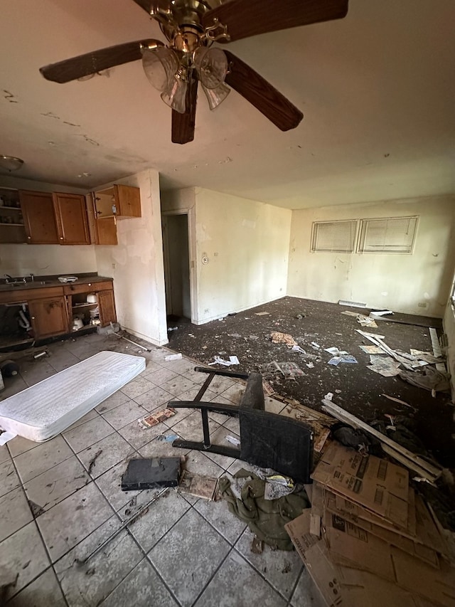 misc room featuring ceiling fan and sink