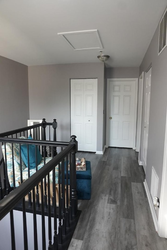 hallway featuring dark hardwood / wood-style floors