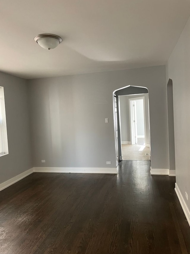 unfurnished room featuring dark hardwood / wood-style floors