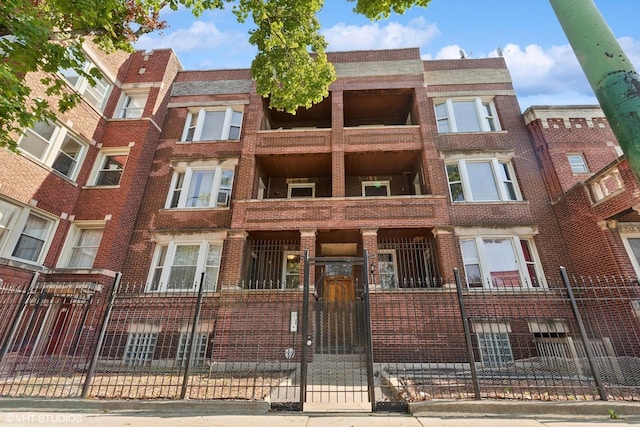 6049 S Eberhart Ave Unit 1-N, Chicago, IL 60637 - view of apartment building / complex with a fenced front yard