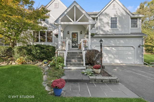 view of front of property featuring a garage and a front lawn