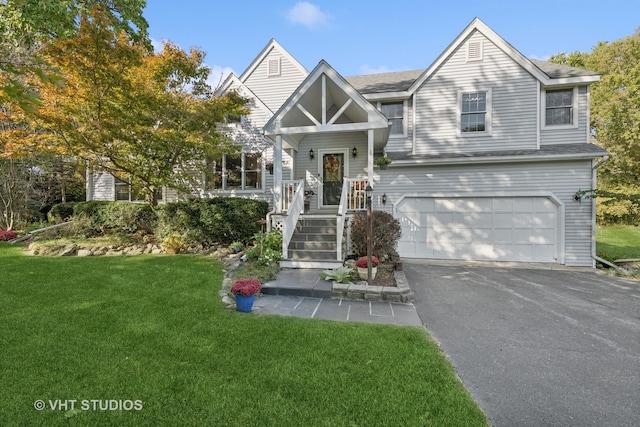 view of front of property featuring a garage and a front yard