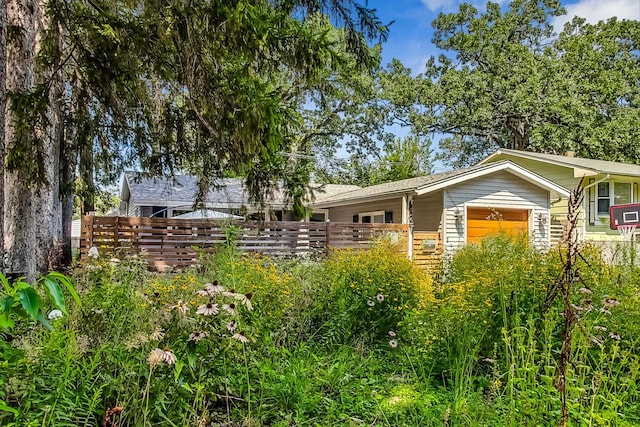 view of side of home featuring a garage