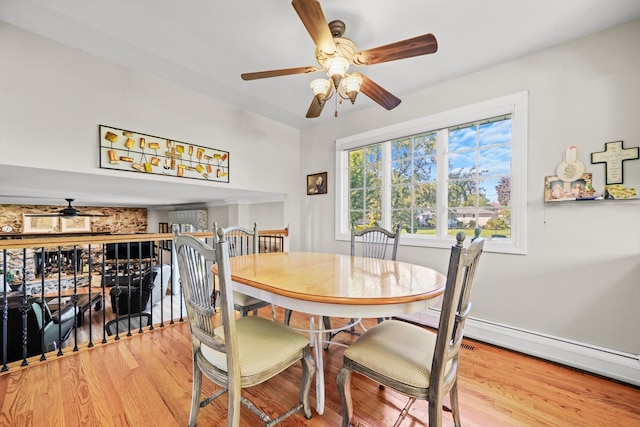 dining area featuring light hardwood / wood-style flooring and ceiling fan