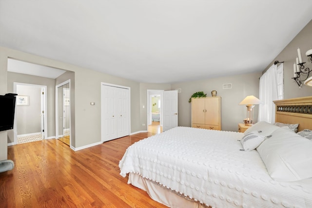 bedroom featuring a closet and light wood-type flooring