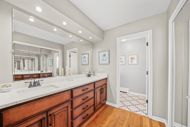 bathroom featuring vanity and hardwood / wood-style flooring