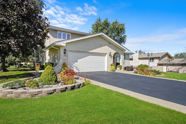 view of front property with a front yard and a garage