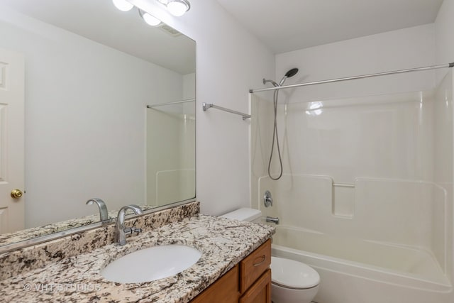 full bathroom with bathing tub / shower combination, vanity, and toilet