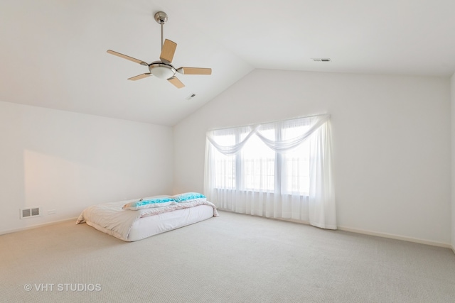 bedroom featuring vaulted ceiling, carpet, and ceiling fan