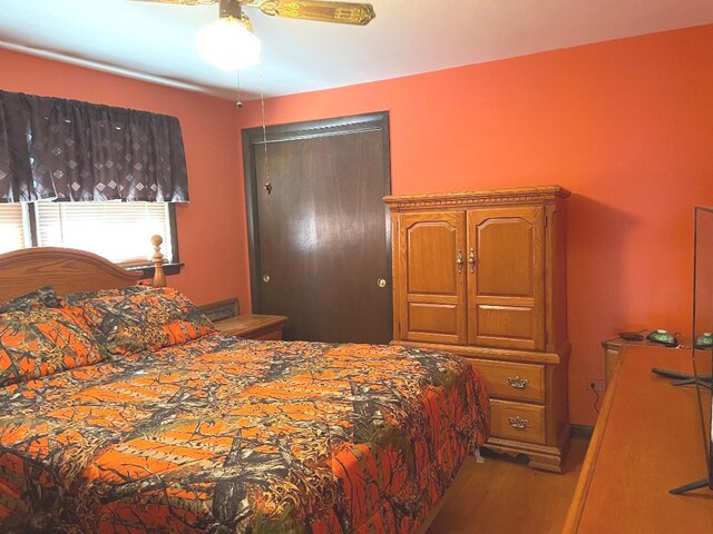 679 Manistee Ave, Calumet City, IL 60409 - bedroom featuring wood finished floors and a ceiling fan