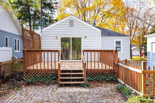 rear view of house with a deck