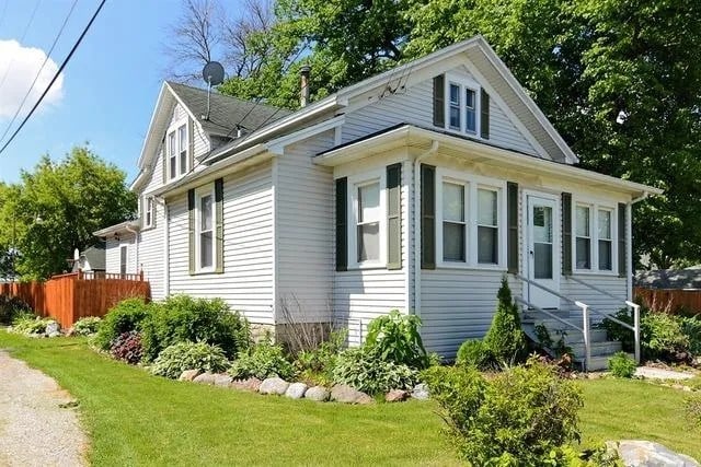 view of side of property with a yard