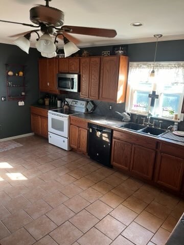 kitchen featuring tasteful backsplash, sink, dishwasher, electric range, and pendant lighting