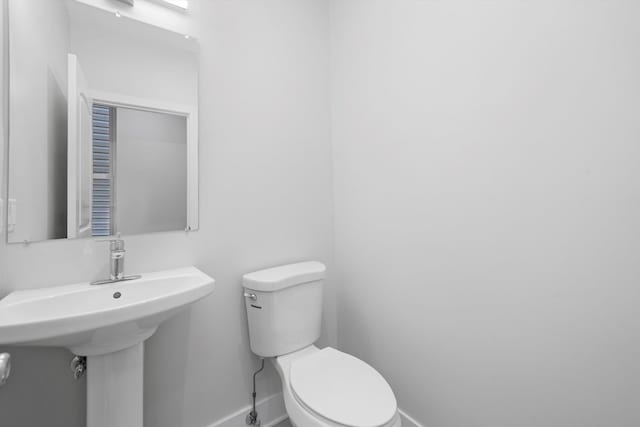 bathroom with sink and toilet