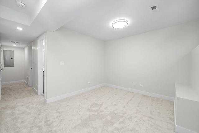 carpeted spare room featuring electric panel