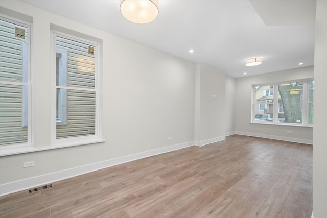 unfurnished room featuring light wood-type flooring