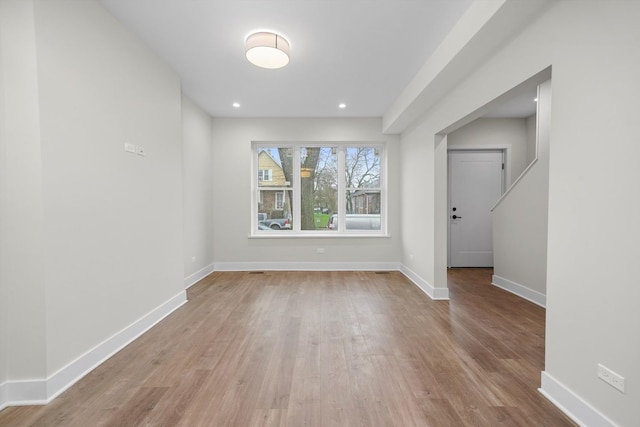 unfurnished room featuring light hardwood / wood-style floors