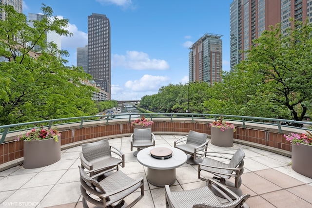 view of patio featuring an outdoor fire pit