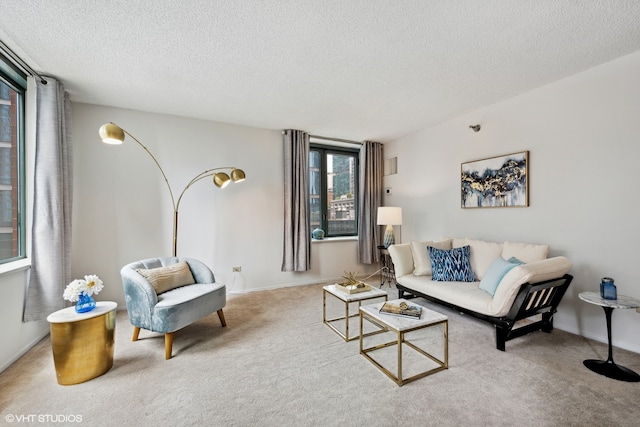 living room featuring a textured ceiling and carpet floors