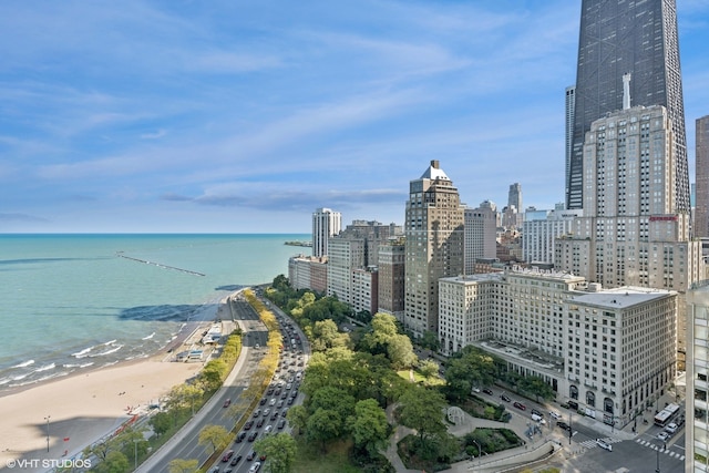 city view featuring a view of the beach and a water view