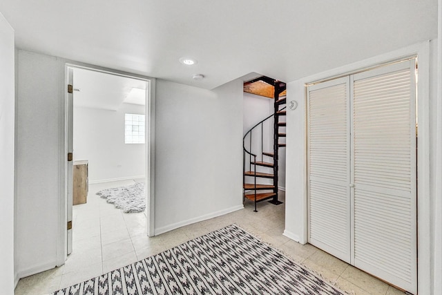 hallway featuring light tile patterned flooring