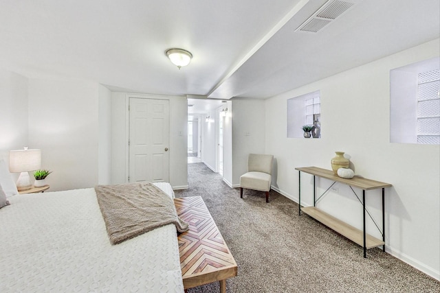 bedroom with multiple windows and carpet floors