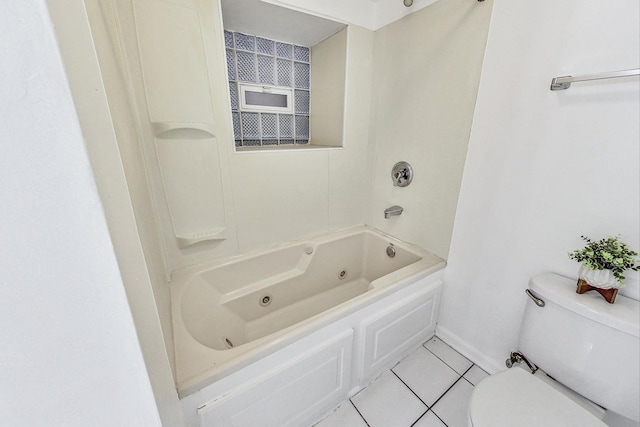 bathroom with toilet and tile patterned floors