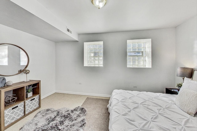 bedroom featuring multiple windows and carpet flooring