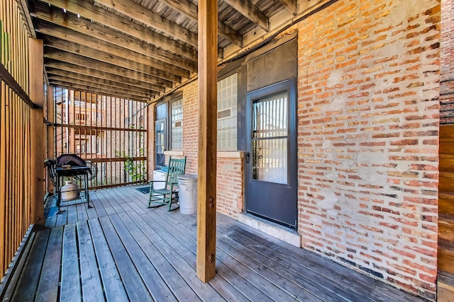 wooden terrace with area for grilling