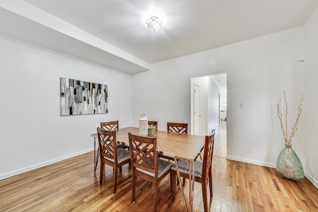 dining area featuring hardwood / wood-style floors