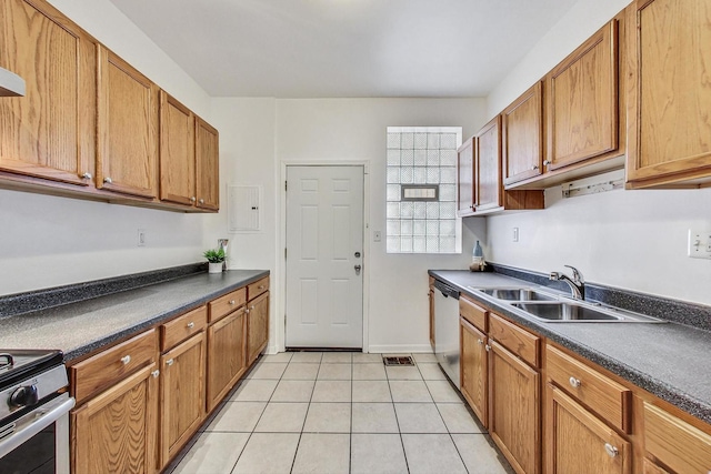 kitchen with sink, appliances with stainless steel finishes, and light tile patterned floors