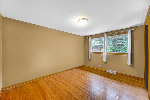 empty room with light hardwood / wood-style floors