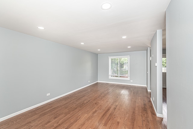 unfurnished room featuring hardwood / wood-style flooring