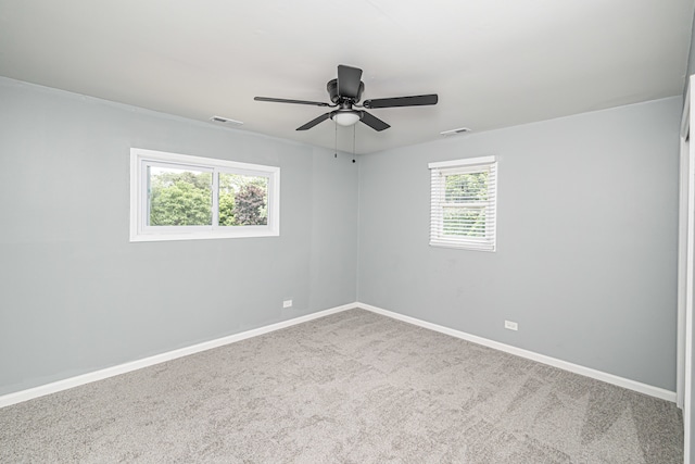 carpeted empty room with ceiling fan