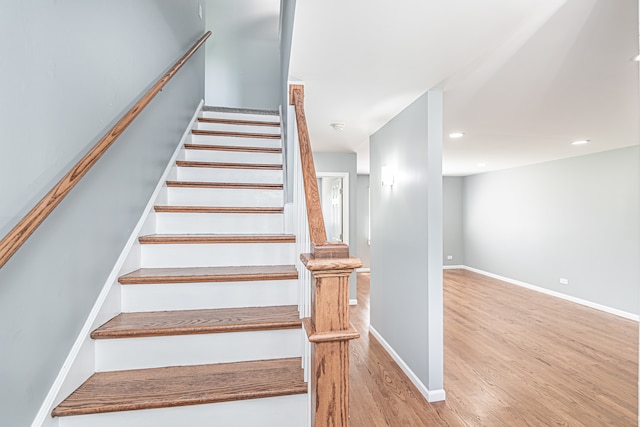 staircase featuring hardwood / wood-style floors