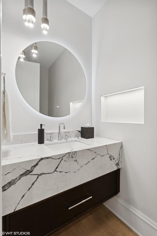 bathroom with vanity and hardwood / wood-style floors