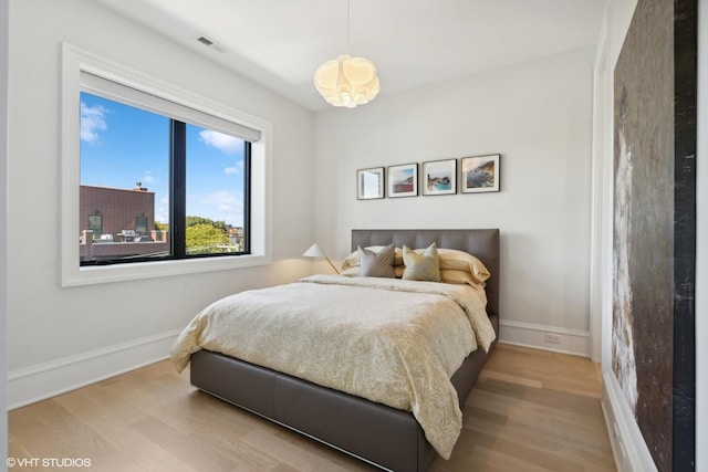 bedroom with light hardwood / wood-style flooring