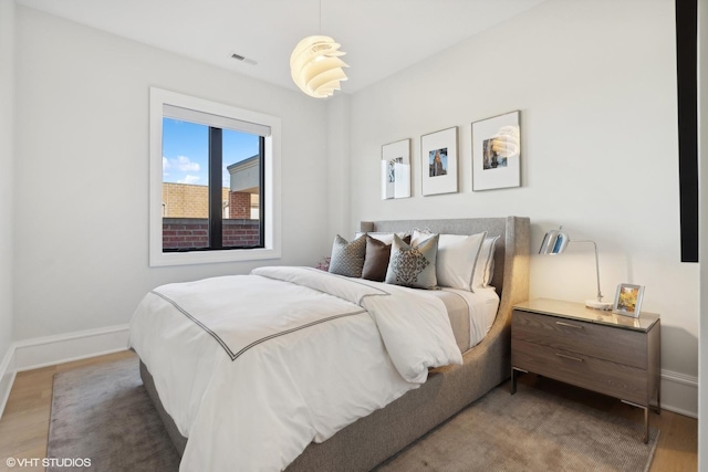 bedroom featuring wood-type flooring