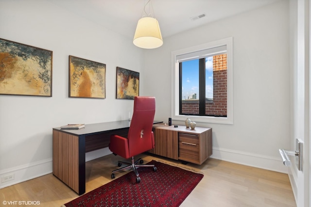 office area with light hardwood / wood-style flooring