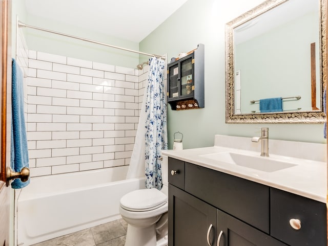 full bathroom with tile patterned floors, shower / bath combo, vanity, and toilet