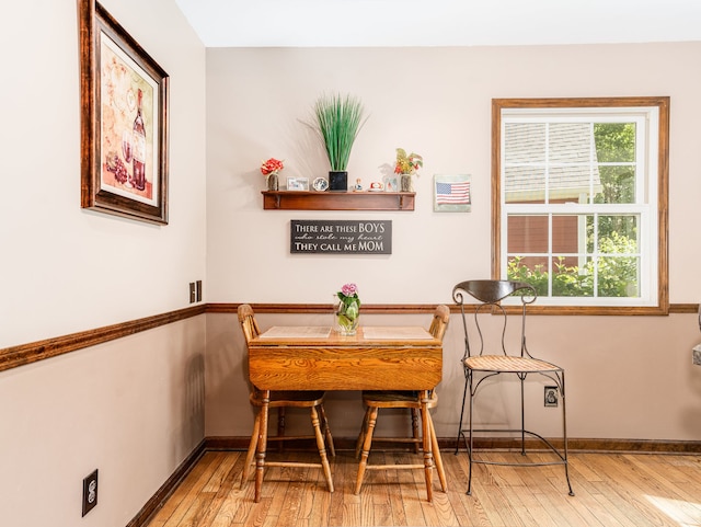 dining space with light hardwood / wood-style flooring