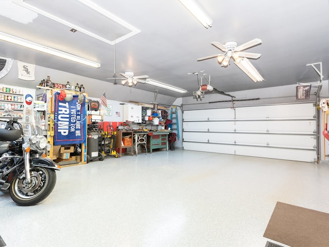 garage with a garage door opener and ceiling fan