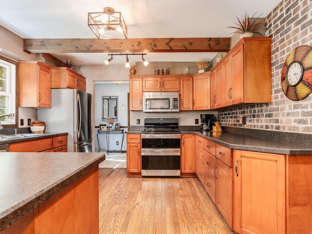 kitchen with beamed ceiling, sink, brick wall, light hardwood / wood-style flooring, and appliances with stainless steel finishes