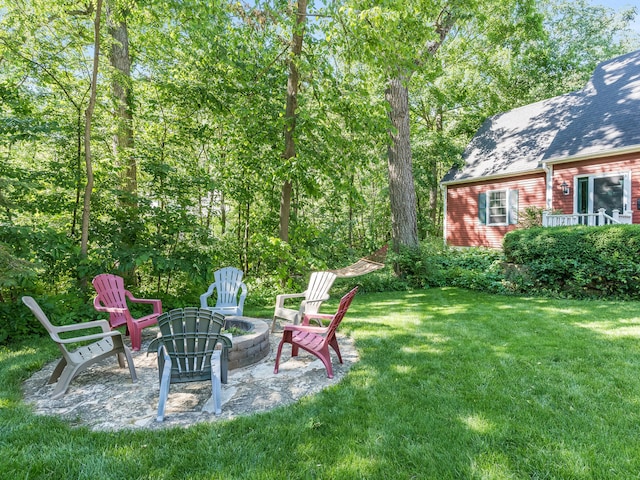 view of yard featuring a patio area and an outdoor fire pit