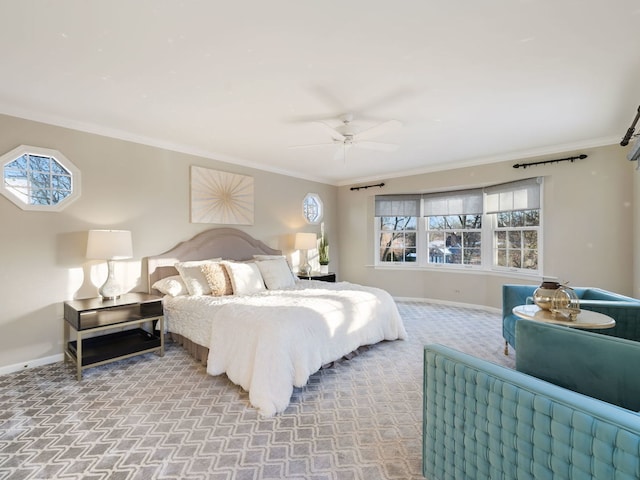 bedroom featuring ceiling fan, light colored carpet, and crown molding