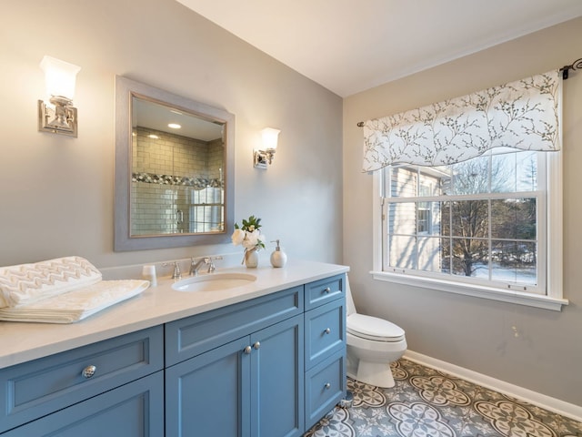 bathroom featuring a shower with door, tile patterned flooring, vanity, and toilet