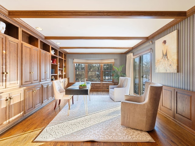 office featuring hardwood / wood-style flooring, built in features, and beam ceiling