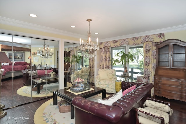 living room with an inviting chandelier, crown molding, and hardwood / wood-style floors