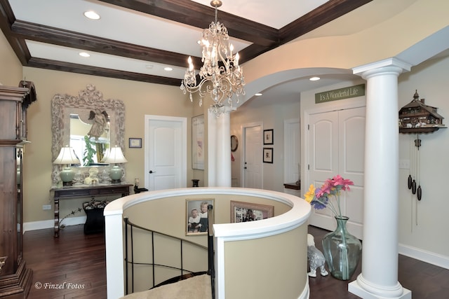 dining area featuring beam ceiling, decorative columns, a chandelier, and dark wood-type flooring