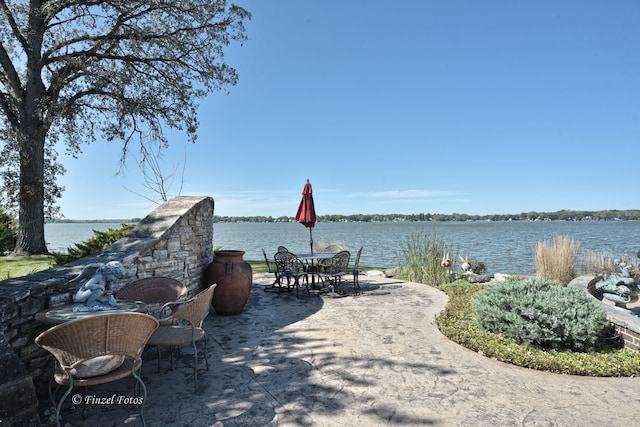 view of patio / terrace with a water view